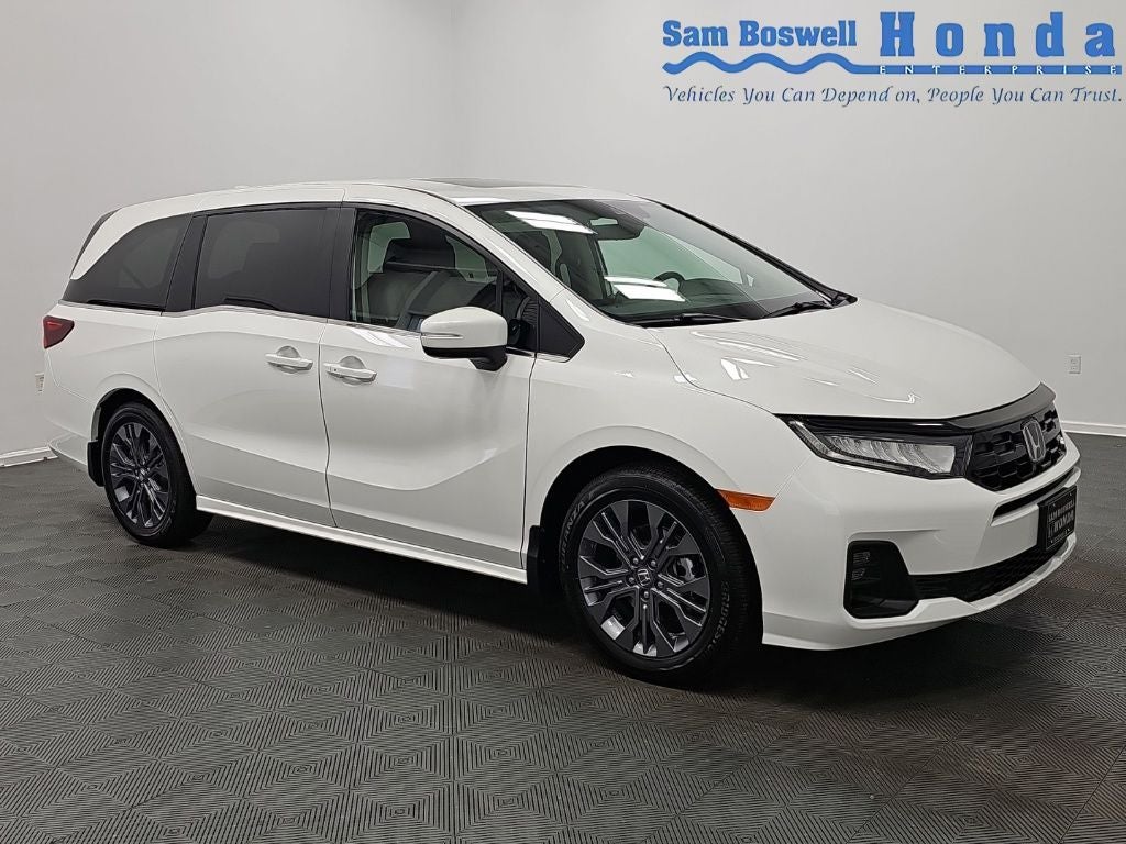 2026 Honda Odyssey Touring in Platinum White Pearl — front three-quarter view